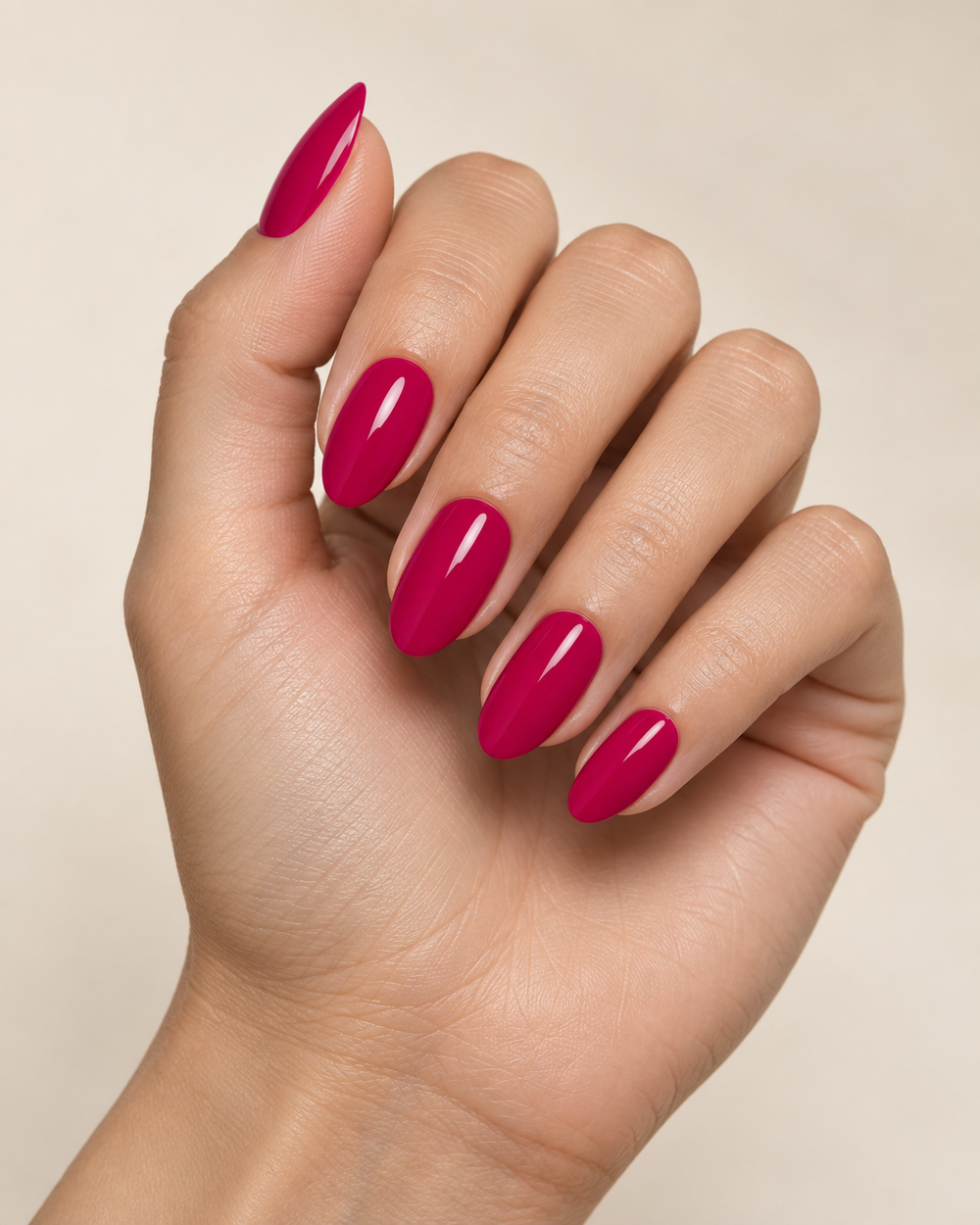 Hand showcasing glossy Crystal Nails magenta gel polish